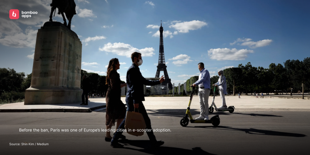 People riding e-scooters near the Eiffel Tower in Paris before the e-scooter ban