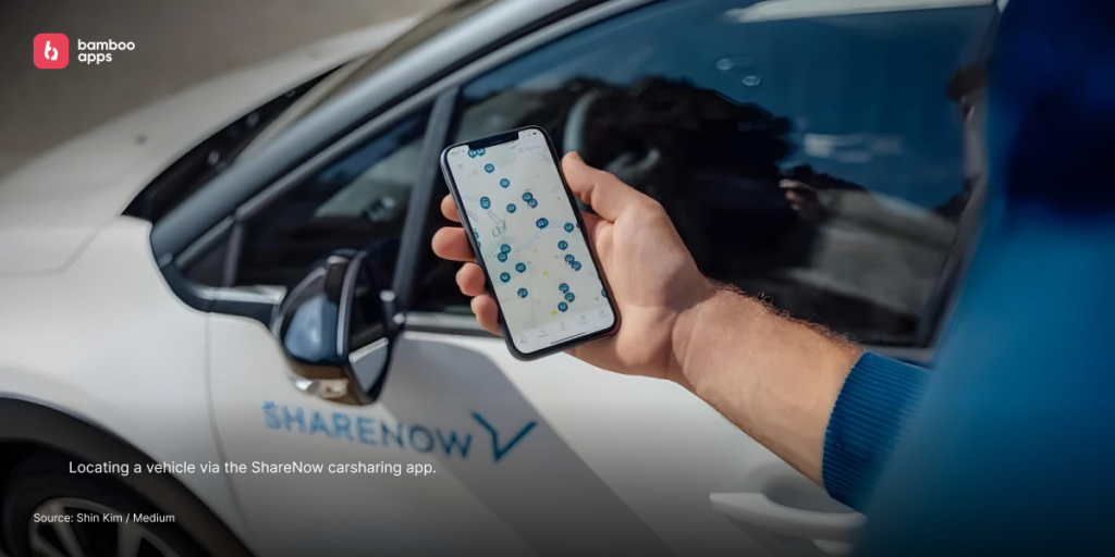 User locating a car with the ShareNow carsharing app on a smartphone